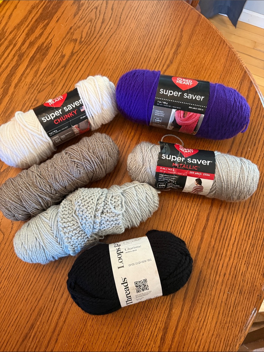 Super Saver Yarn Bundle in Purple, Black, white, gray metallic, and brown.